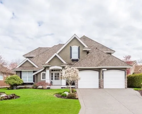 Street view of a nice home with pest control services for protection